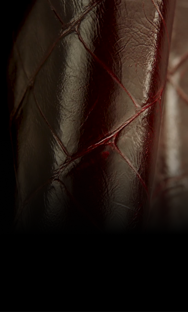 A close-up view of the texture of the burgundy Croc leather.