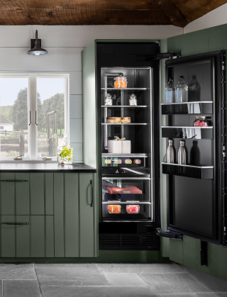 A view of the main bank of cabinets, featuring a panel-ready beverage center and a column refrigerator. A view of the main bank of cabinets, featuring a panel-ready beverage center and a column refrigerator.