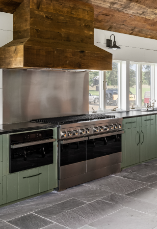 Another view of the kitchen, featuring a wall oven and range. Another view of the kitchen, featuring a wall oven and range.