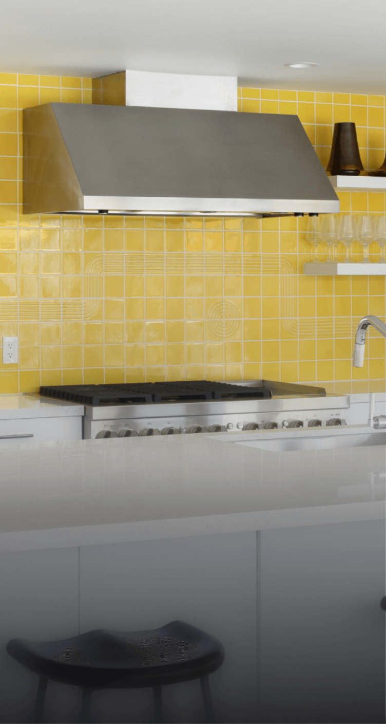 A JennAir® Professional-Style Range in a yellow kitchen. A JennAir® Professional-Style Range in a yellow kitchen.