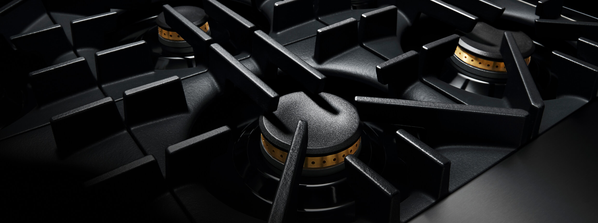 A close up of the geometric grates of a RISE™ Rangetop. A close up of the geometric grates of a RISE™ Rangetop.