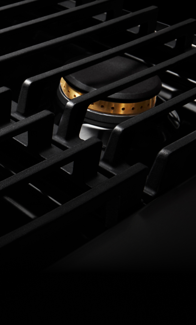 Closeup of the cast iron grates on a gas rangetop. Closeup of the cast iron grates on a gas rangetop.
