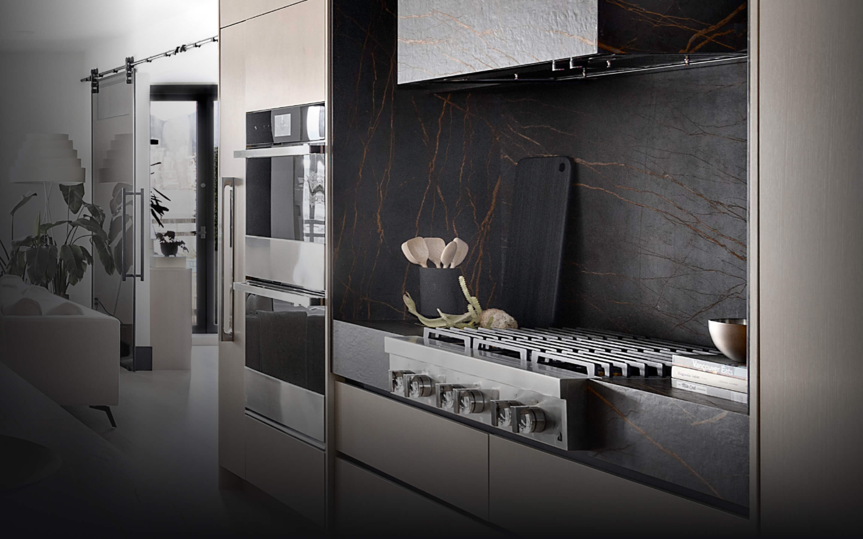 A JennAir® Gas Rangetop in a light-colored kitchen with dark accents. A JennAir® Gas Rangetop in a light-colored kitchen with dark accents.