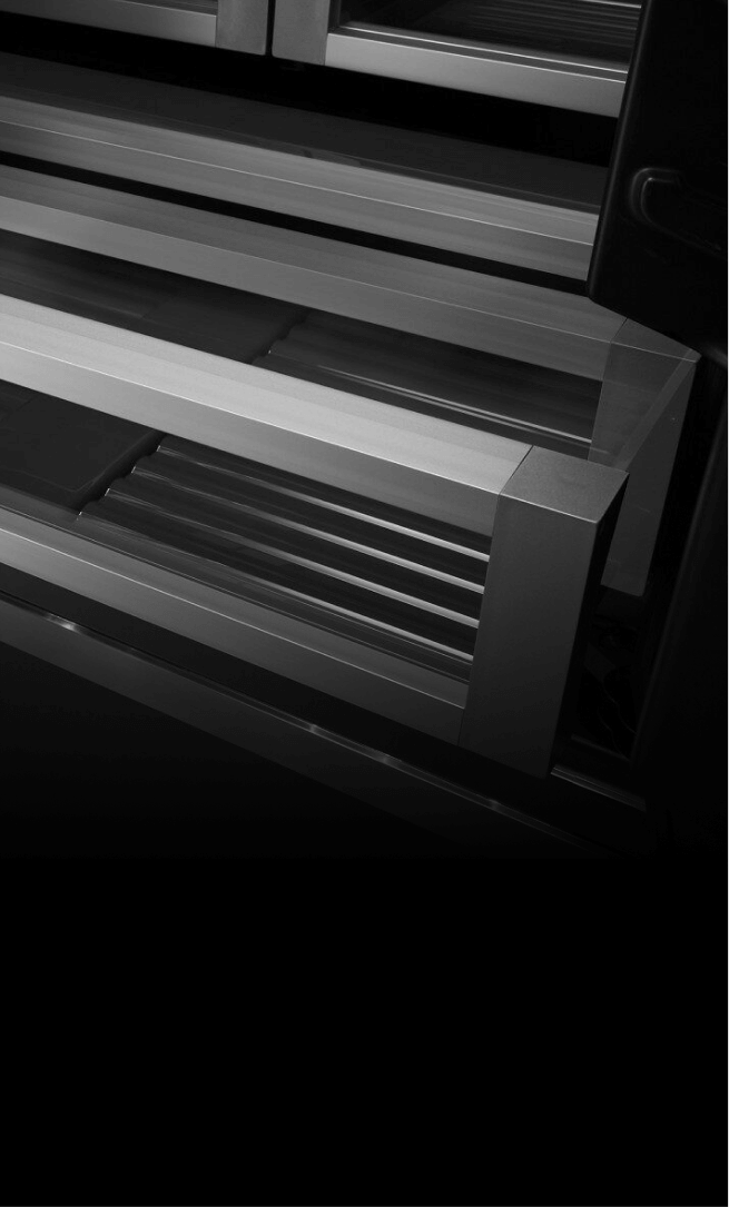 A crisper drawer in a JennAir® built-in refrigerator, slightly open. A crisper drawer in a JennAir® built-in refrigerator, slightly open.