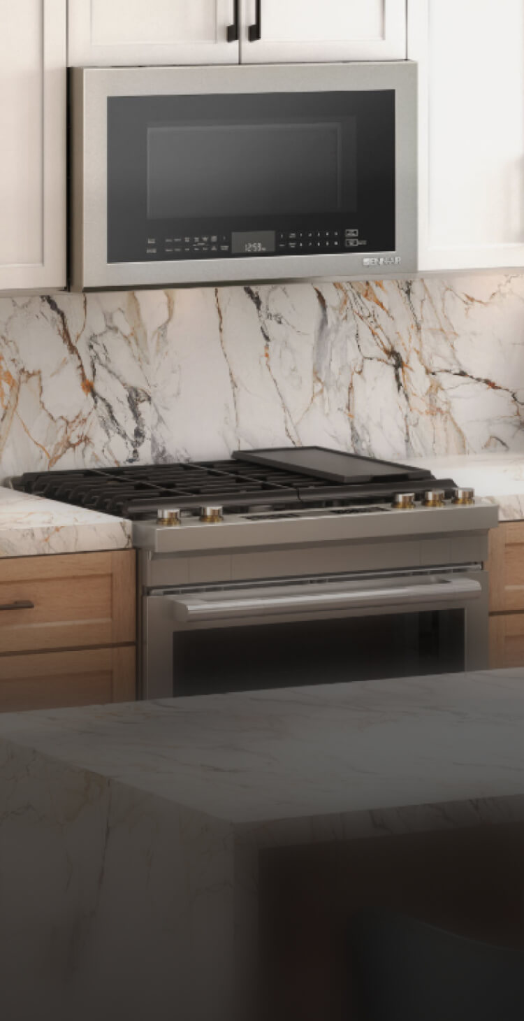 A JennAir® RISE™ Slide-In Range in a high-end kitchen. A JennAir® RISE™ Slide-In Range in a high-end kitchen.