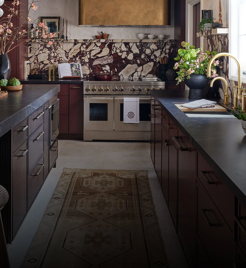 A burgundy kitchen featuring JennAir appliances.