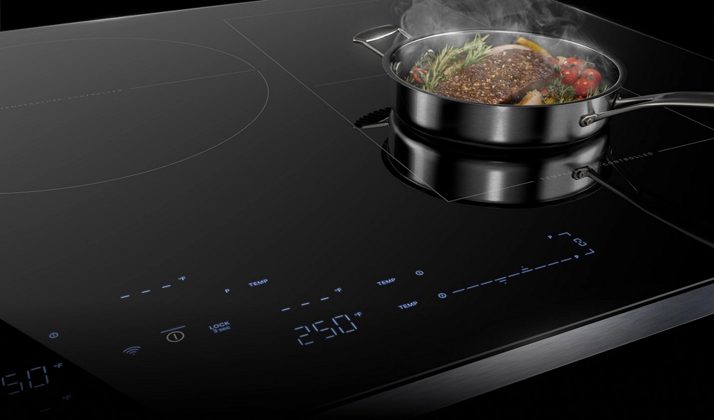 A pan steaming on an induction cooktop.