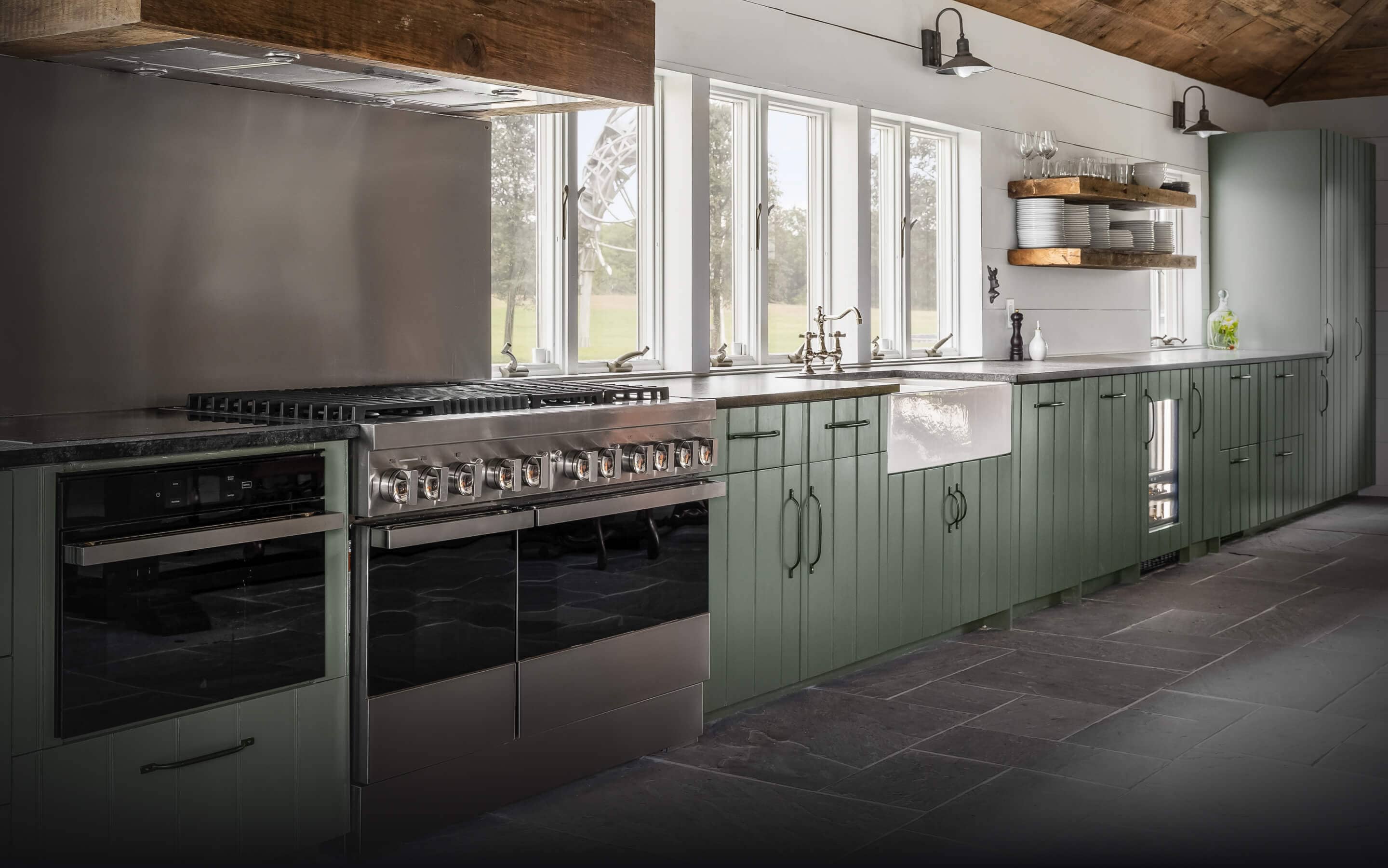 A JennAir® NOIR™ Dual-Fuel Range in a high-end kitchen.