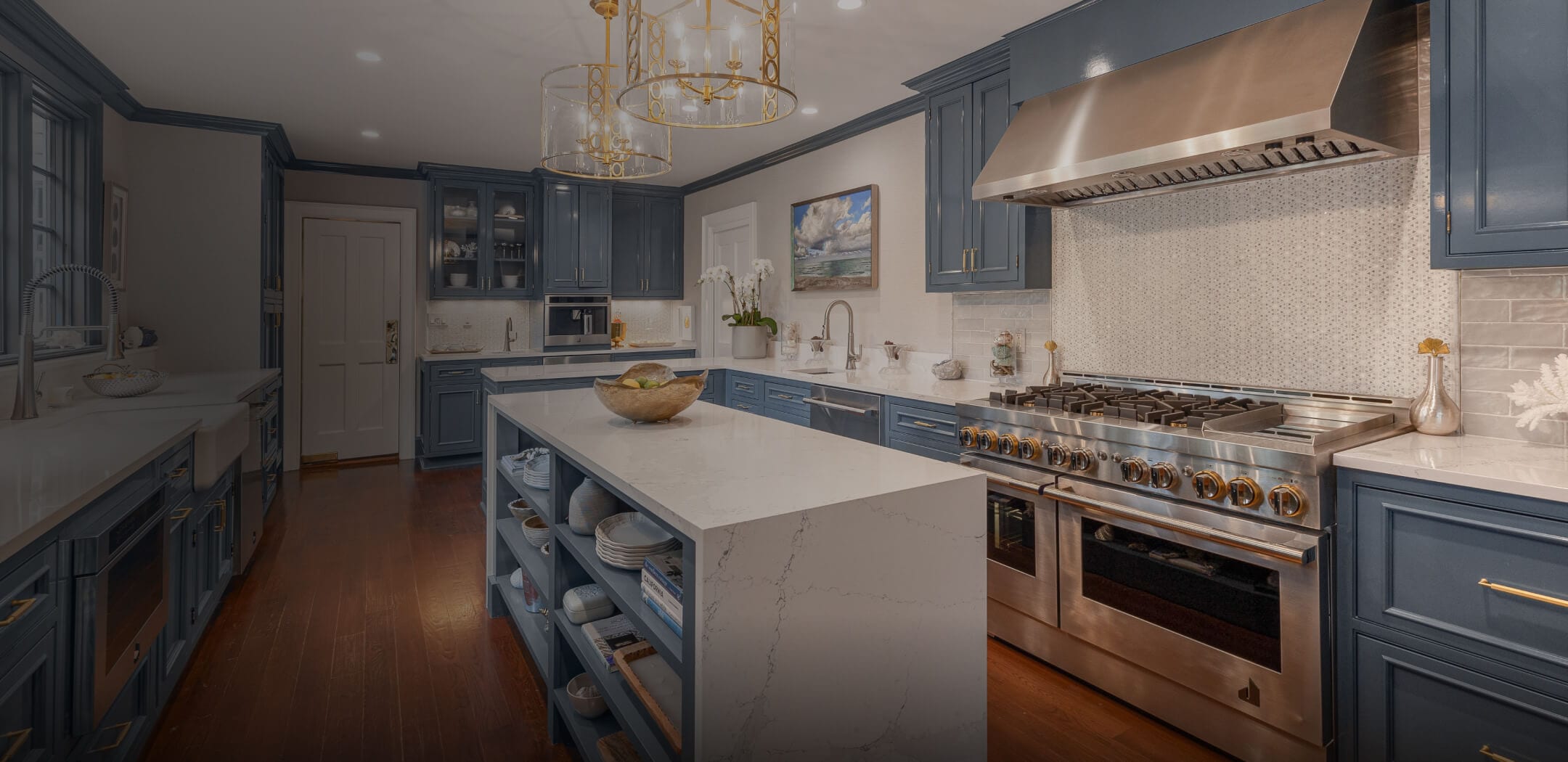 A JennAir® Professional-Style Range in a light blue luxury kitchen.