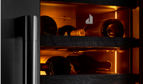 The interior of the JennAir® wine column refrigerator, showing the Ambra Lighting.