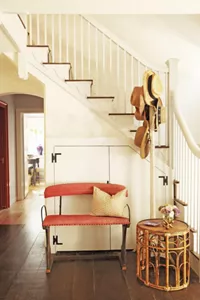 The red bench and decor in the Garden Foyer. 