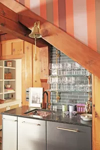 The wet bar and glassware on shelves in the Great Room.