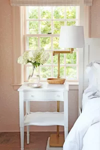 The side table next to the bed in the Purple Bedroom.